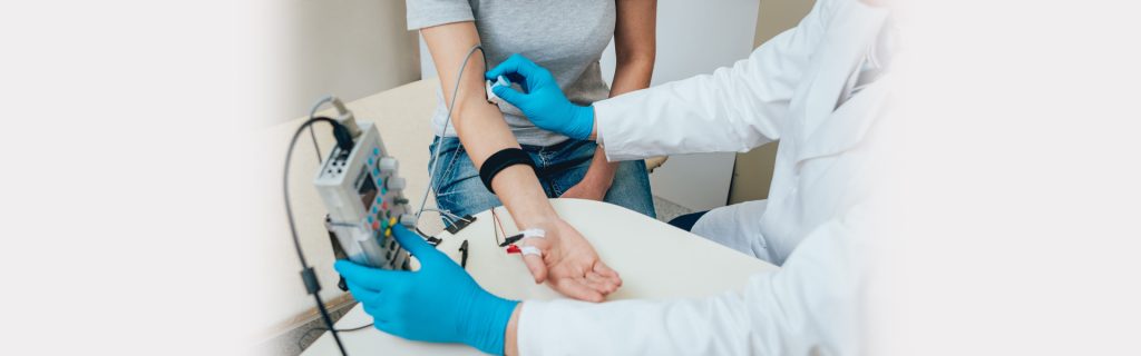 woman connected to a diagnostic machine to check her chronic disease by a doctor