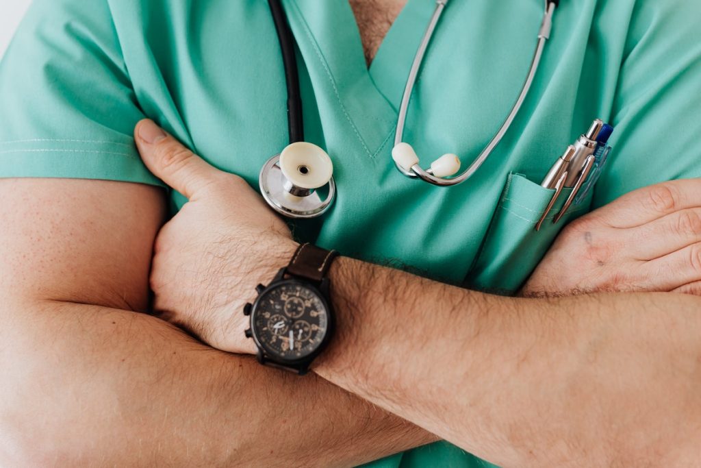 medical professional crossing his arms